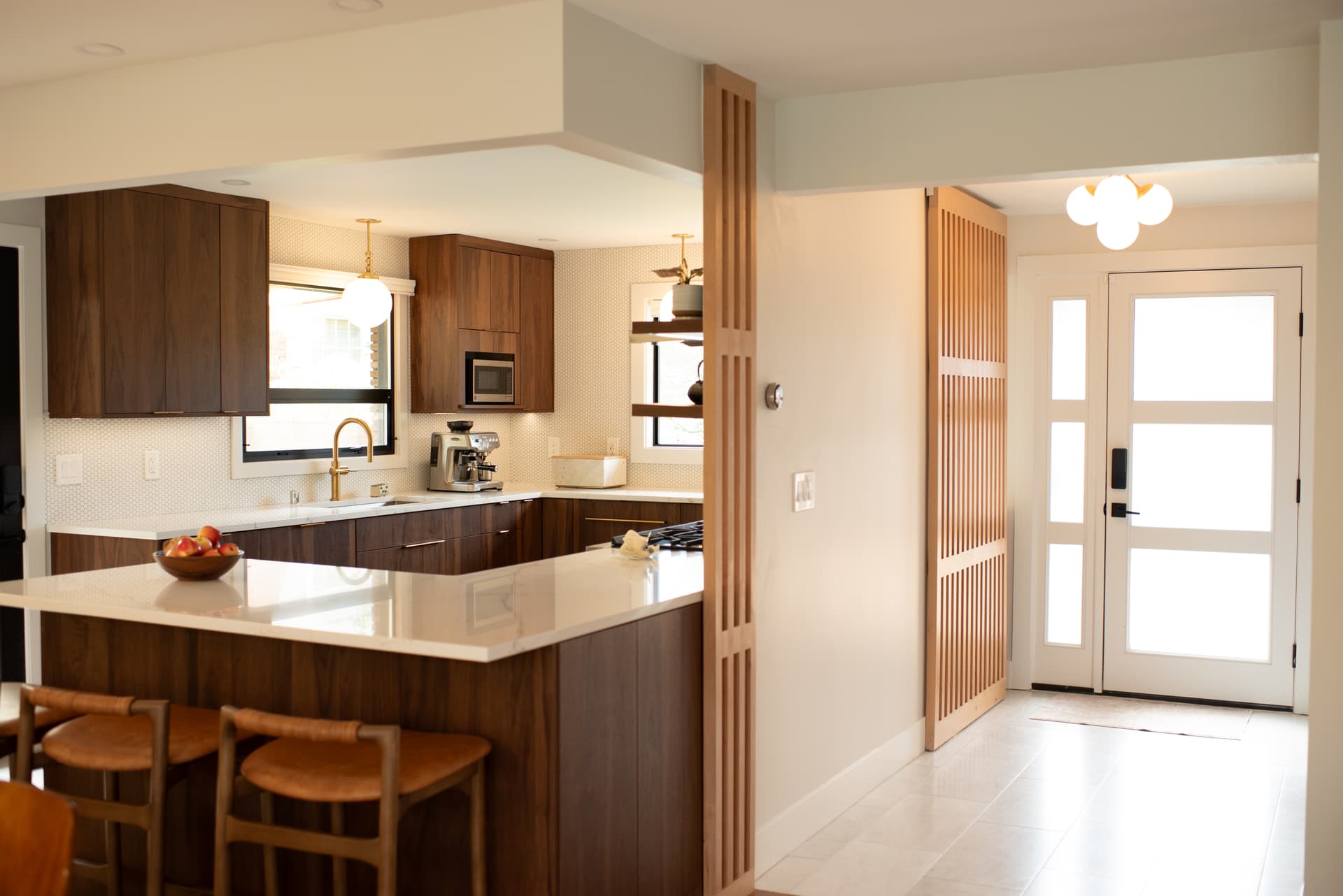 View from living area into kitchen and foyer