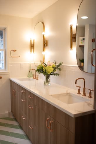 Hall bath vanity with rose gold fixtures