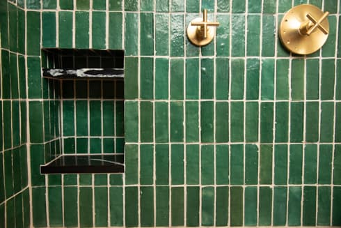 Shower detail with brass fixtures