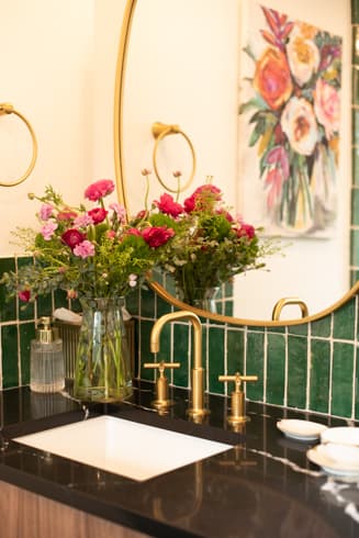 Vanity detail with brass fixtures