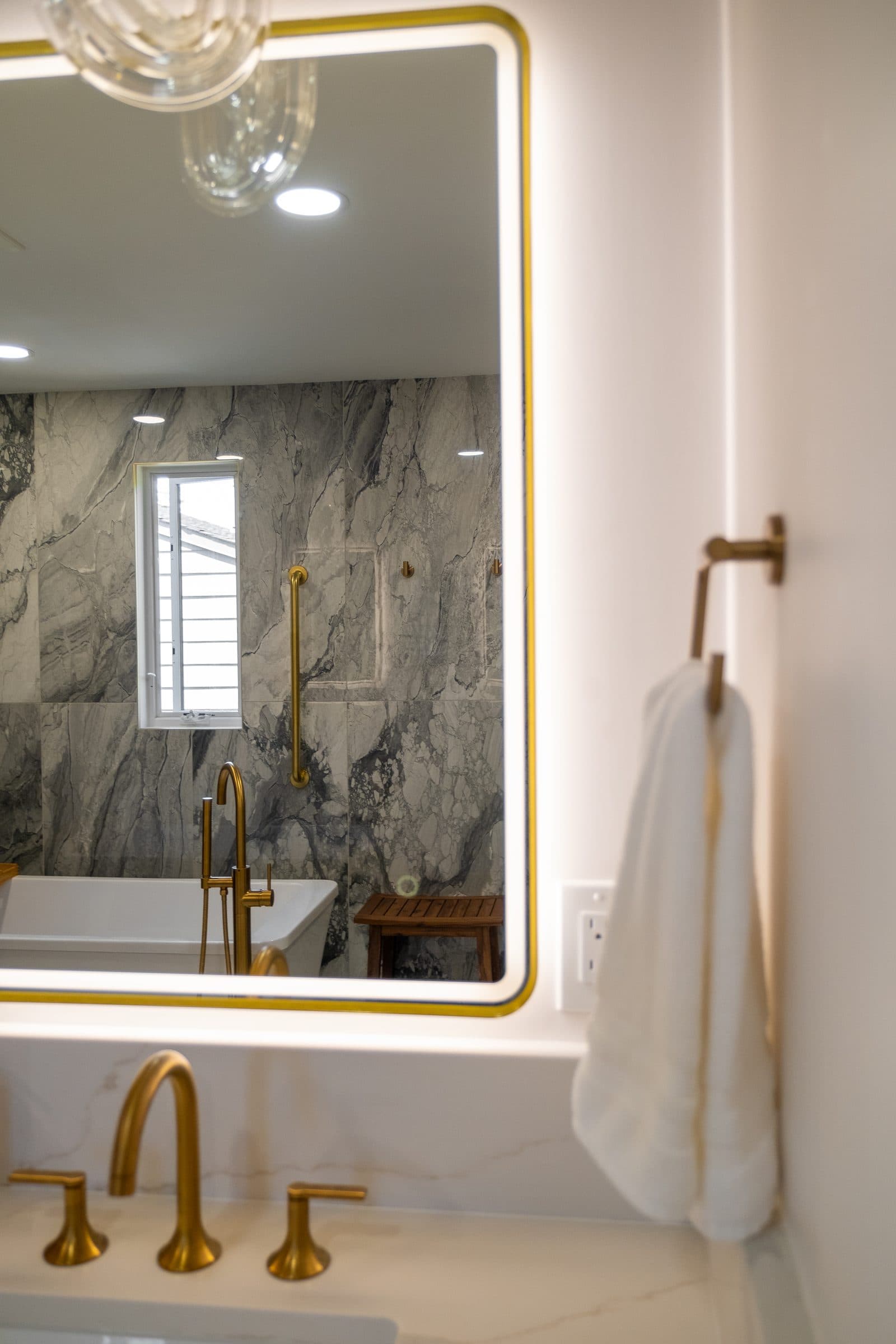 Vanity detail with brass fixtures