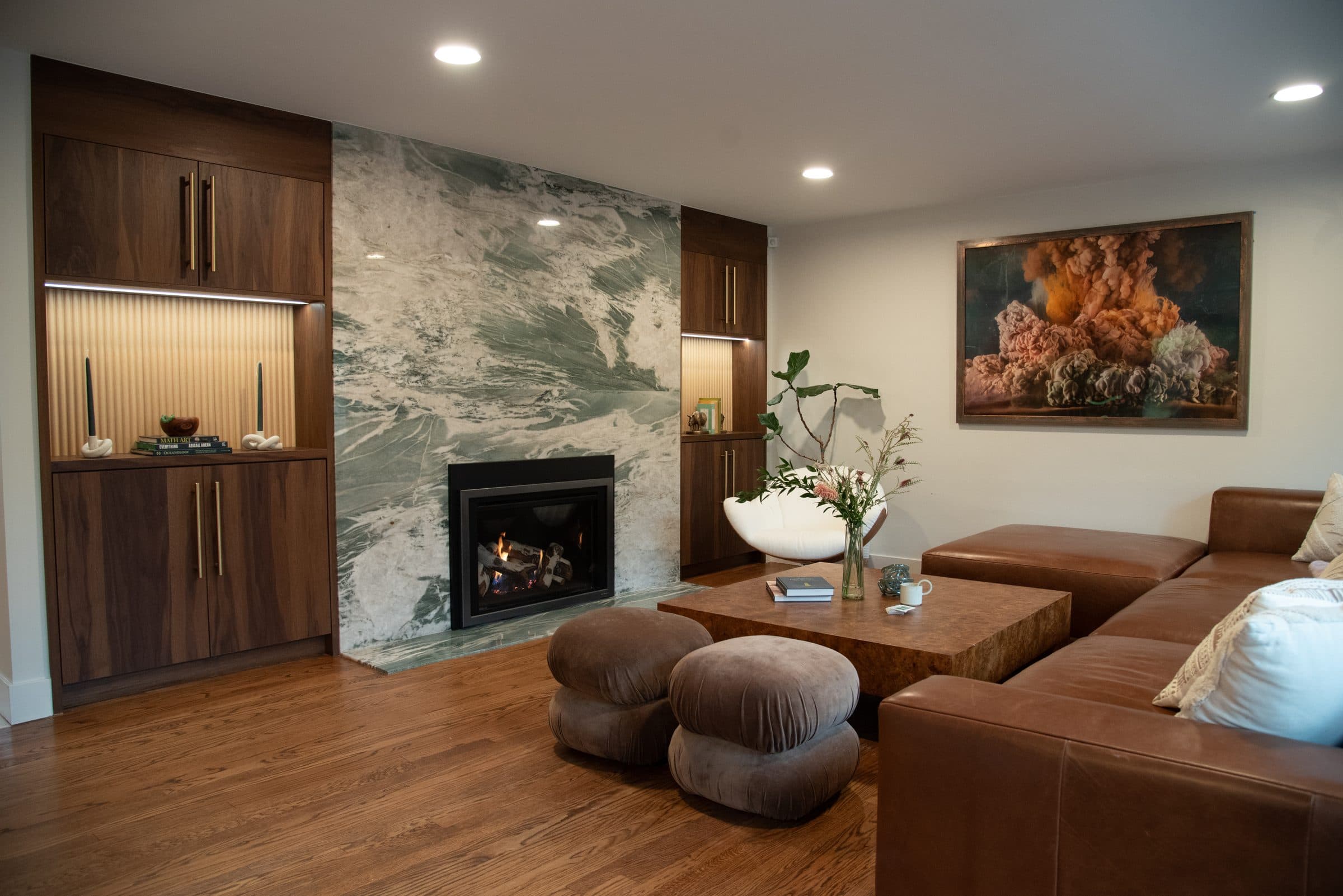 Living room with dramatic marble fireplace surround