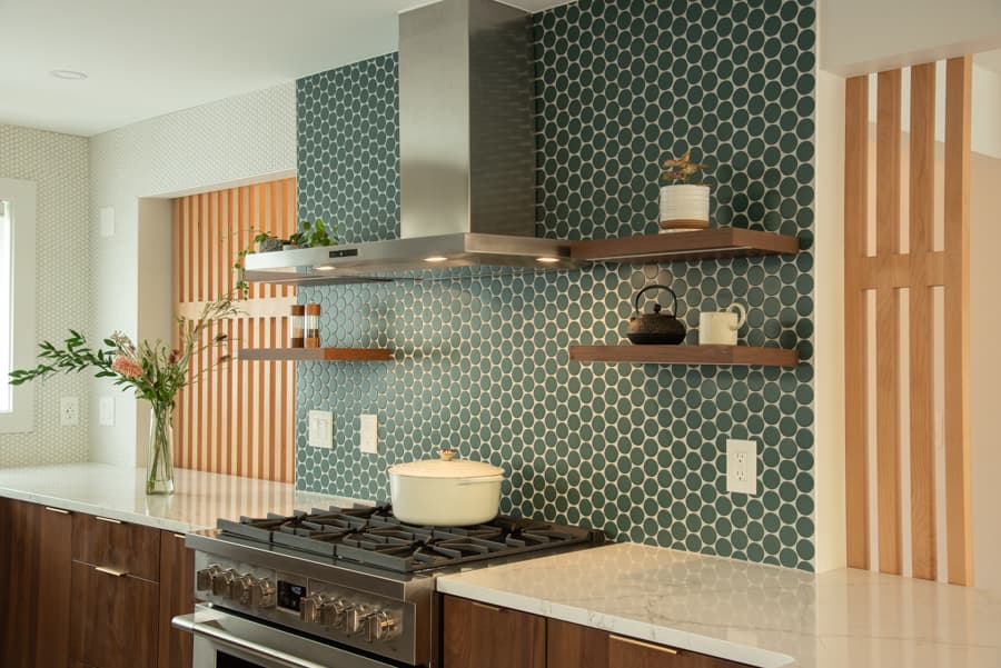 Cooking area detail with range and floating shelves
